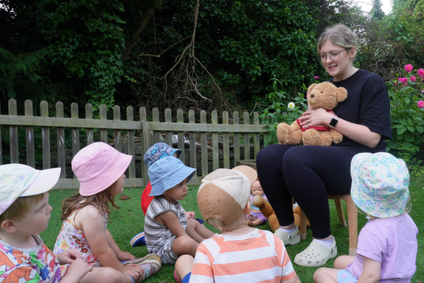 Early Years Teacher telling story to children